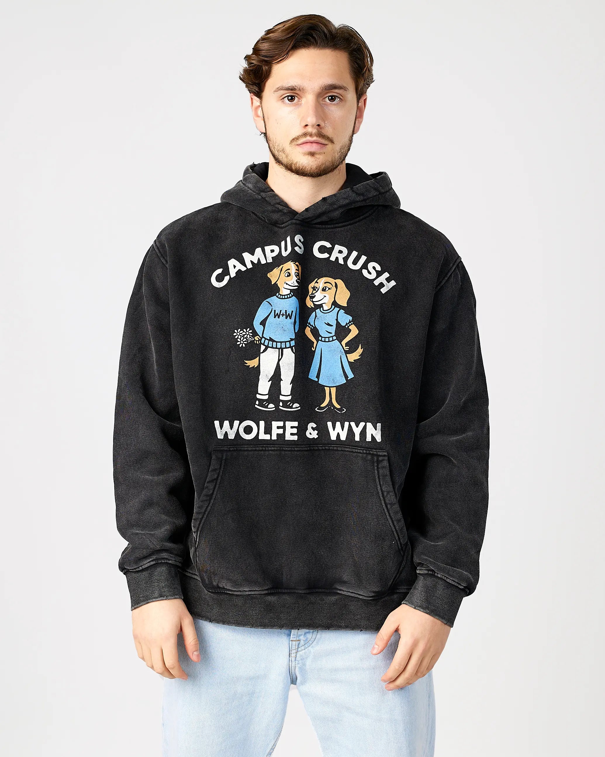 Person wearing a black hoodie with 'Campus Crush' design and text, on a plain background