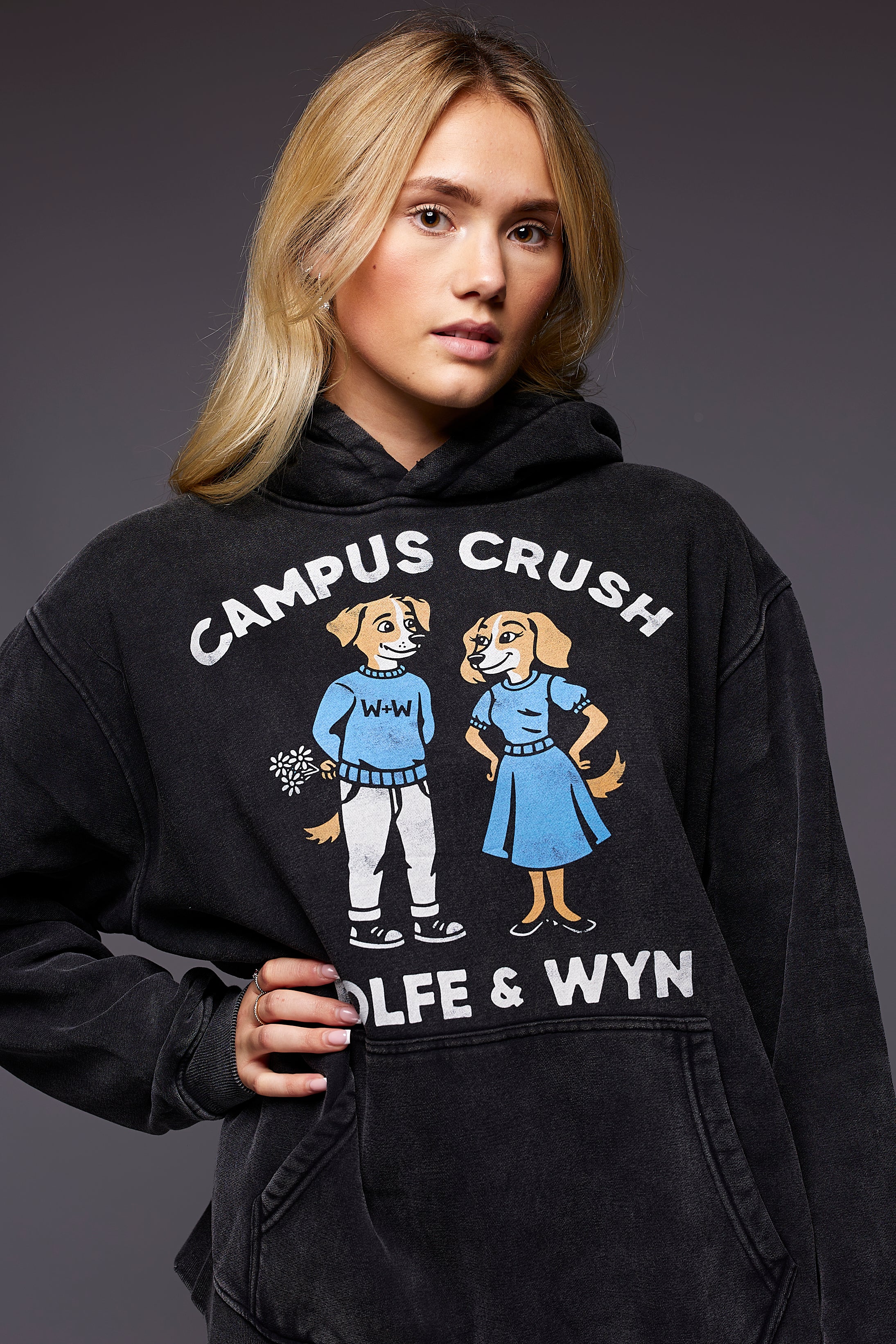 model wearing a black hoodie with 'Campus Crush' design and text