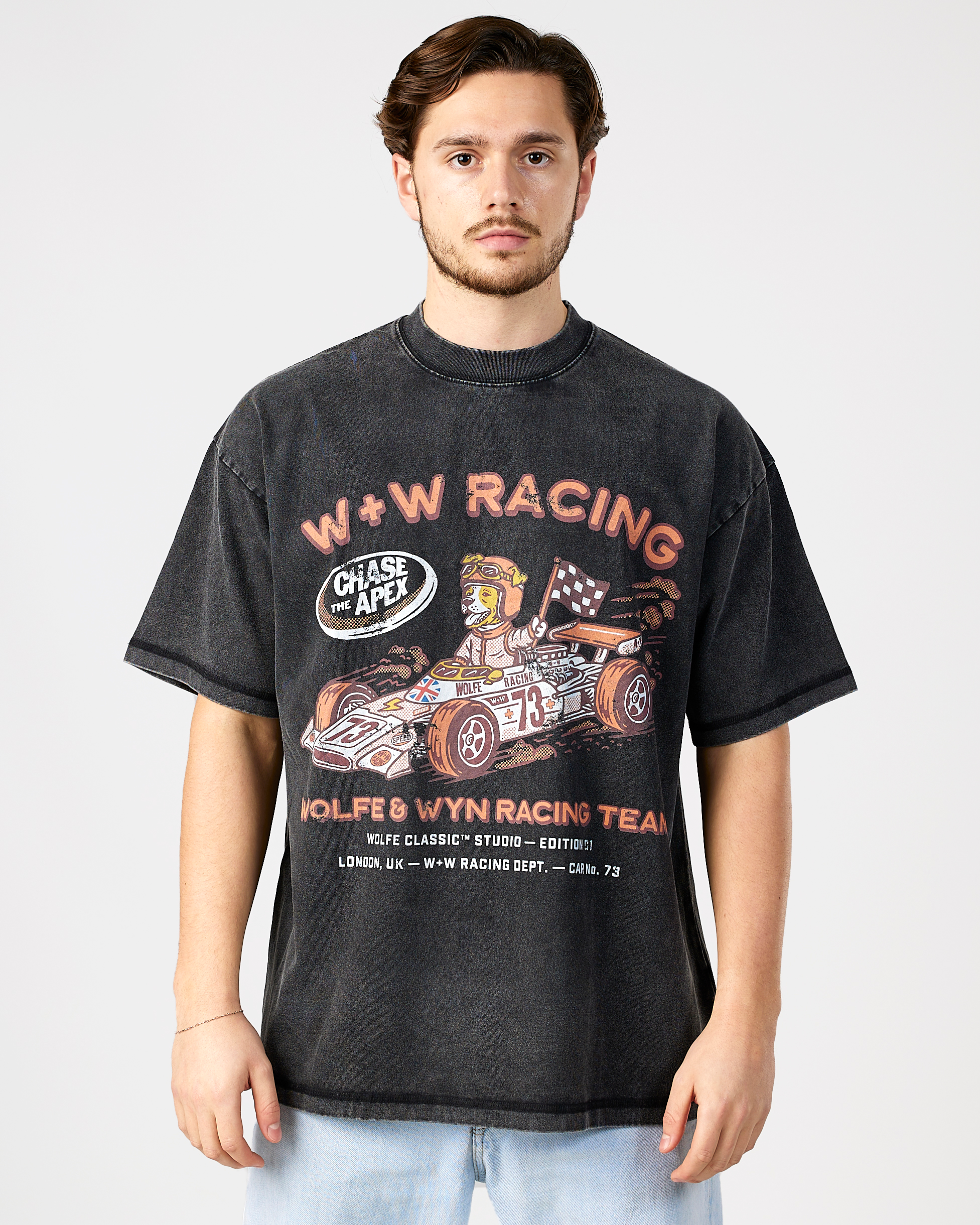 model wearing a black t-shirt with racing graphics and text