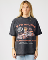 model wearing a black t-shirt with racing graphics and text