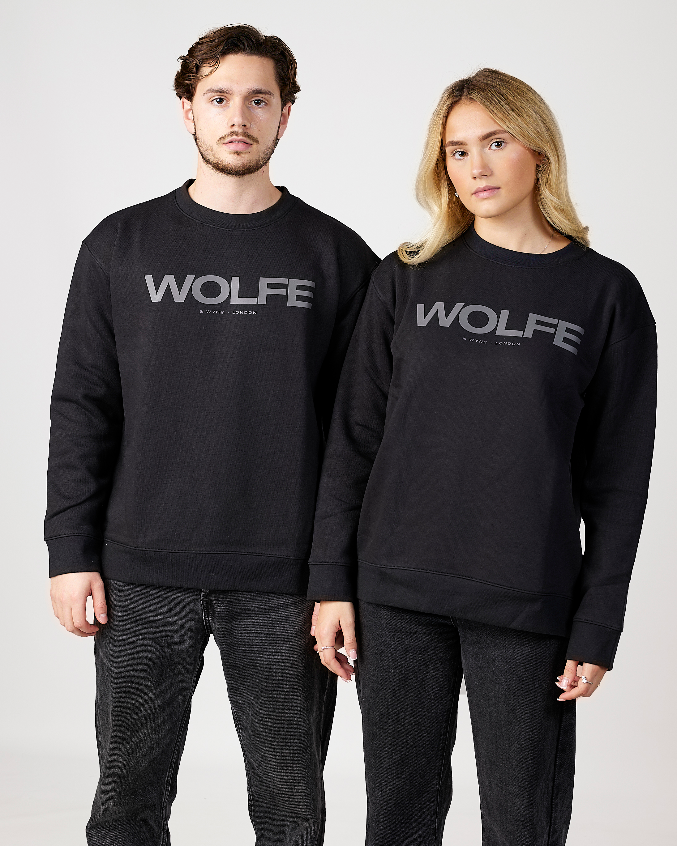 models wearing black 'WOLFE' sweatshirts on a plain background